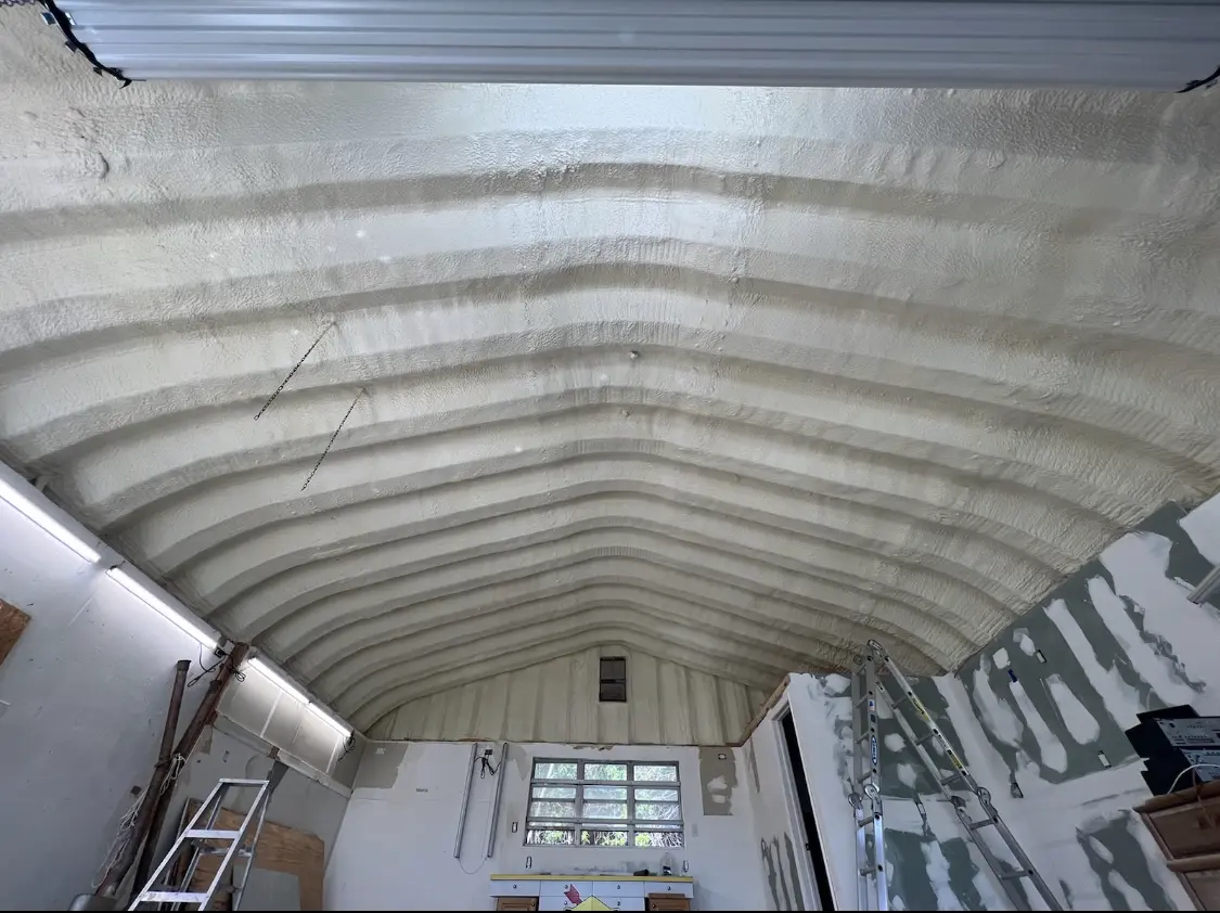 Spray polyurethane foam applied to the underside of a metal roof deck in Yelm